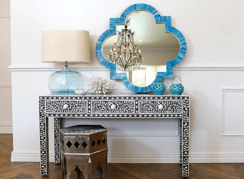 Blue bone inlay mirror above patterned console