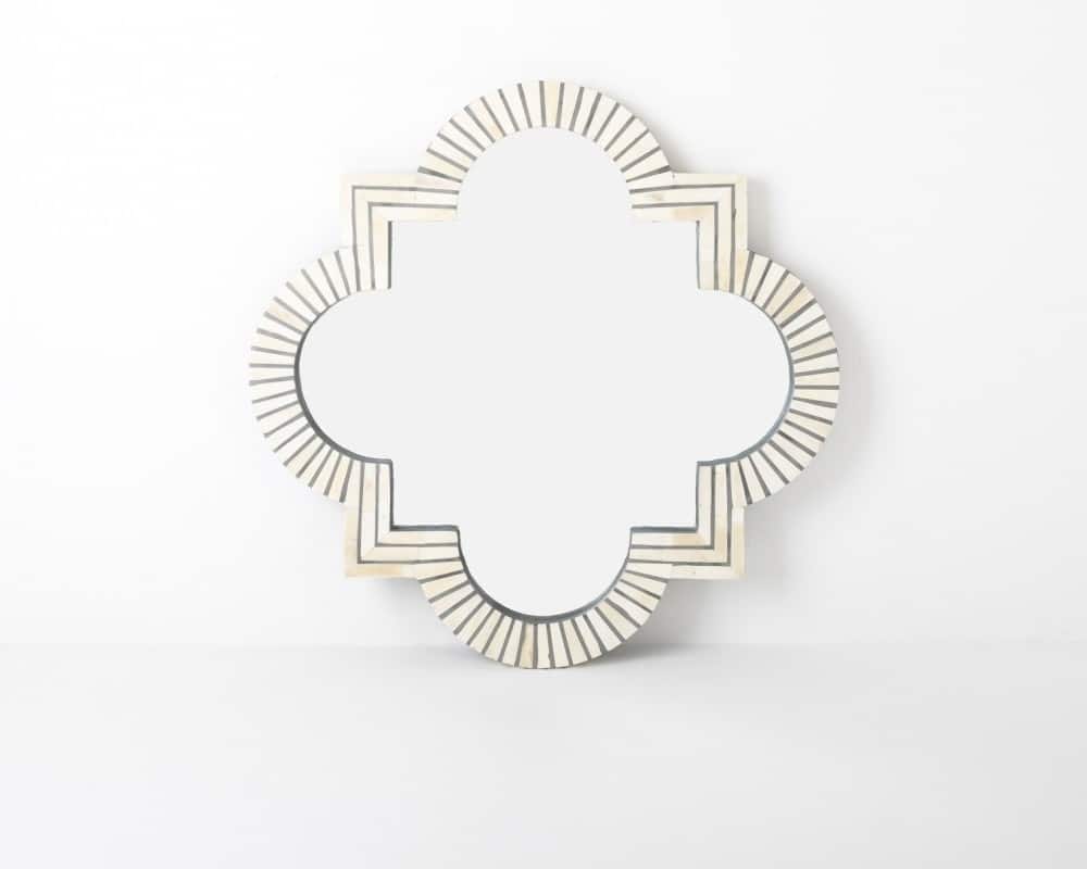 A quatrefoil bone inlay mirror with a striped pattern