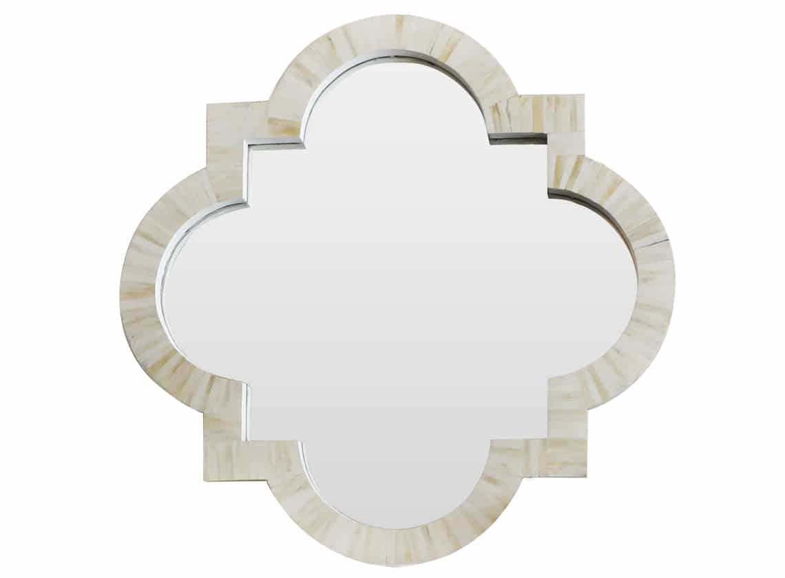 A quatrefoil bone inlay mirror with a carved wooden frame