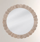 A round bone inlay wall mirror with a bleached finish